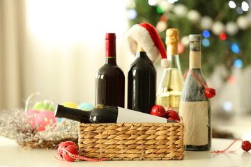 Wine in wicker box and Christmas decor in a room