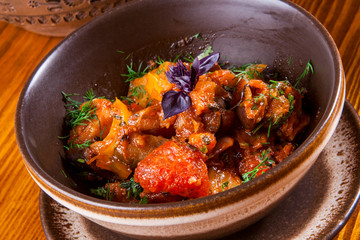 Caucasian cuisine. Ajapsandali with eggplant, pepper, tomato and herbs