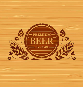 Vector template beer emblem on a wooden background