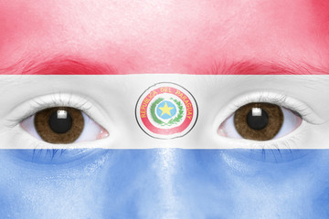 human's face with paraguayan flag
