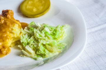 Mashed potatoes, gravy polytoe meat slices of fried meat. Salad of Chinese cabbage. Delicious lunch restaurant food. Dude looks sochno and delicious