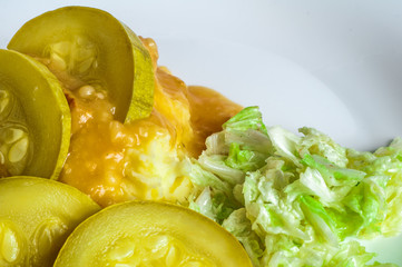 Mashed potatoes, gravy polytoe meat slices of fried meat. Salad of Chinese cabbage. Delicious lunch restaurant food. Dude looks sochno and delicious