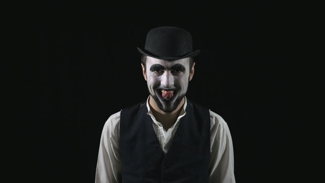 Young scary crazy evil mime