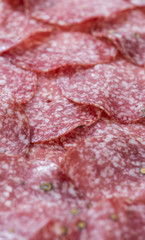 Salami (selective focus) as background image