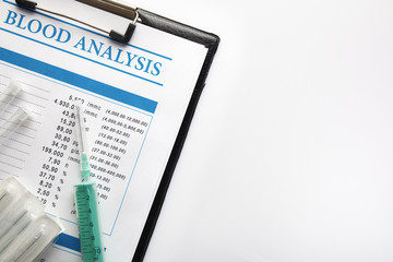 Blood test report in a black folder