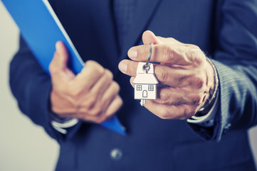 Hand with a house key 