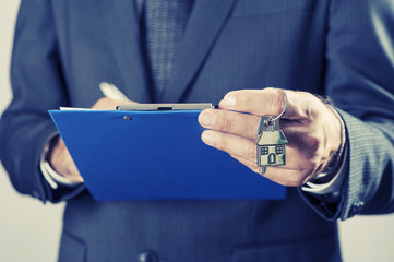 Hand with a house key 