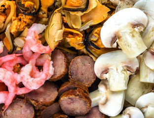 shrimp, mussels, mushrooms, salami . background ingredients for