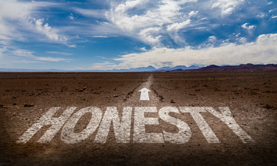 Honesty written on desert road
