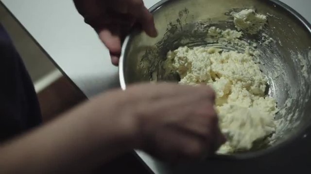 Woman prepares the dough for the cookies