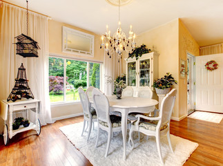 Perfect kitchen with white interior, yellow walls, and hardwood