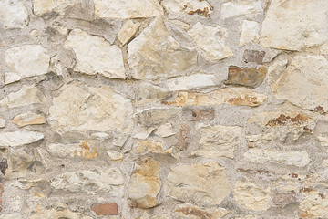 Beige stone mosaic wall background texture