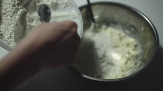 Woman prepares the dough for the cookies
