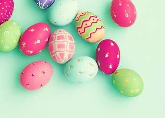 Fototapeta na wymiar Vintage pastel easter eggs over mint background