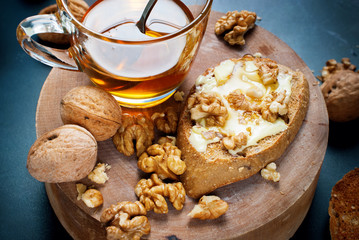 Sandwich with Butter Walnuts Honey on Chopping Board
