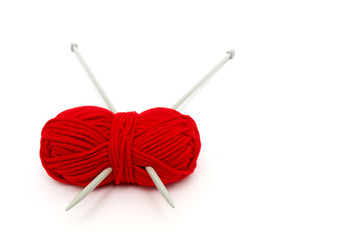 Ball of yarn with knitting needles