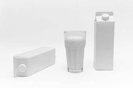 White blank milk box and a glass of milk, on white background