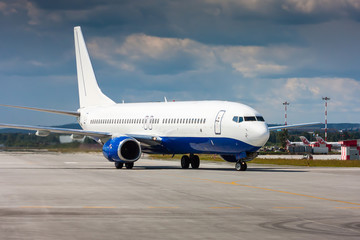 Fototapeta na wymiar Passenger airplane on the runway