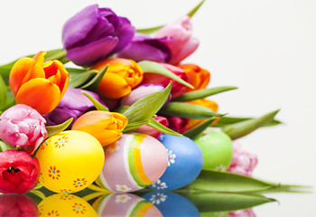 Fototapeta na wymiar Fresh color tulips with easter egg. Spring time