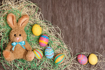 Easter eggs hand painted, rabbit, wood background