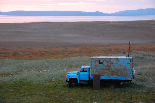 Old broken truck adapted as shed at tundra island