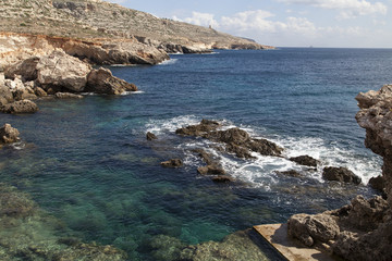 rocky coast of  Mediterranean Sea with blue water on Malta, Eurorope