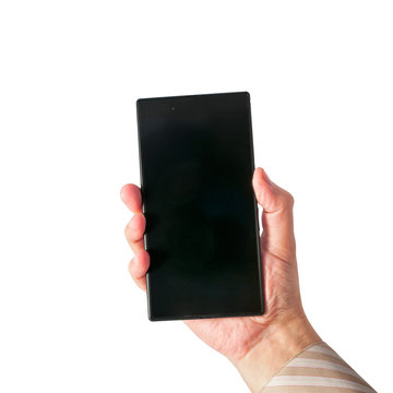 Man holds in hand smartphone in portrait mode isolated on white.
