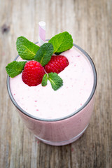 Raspberry milk shake with mint decor.