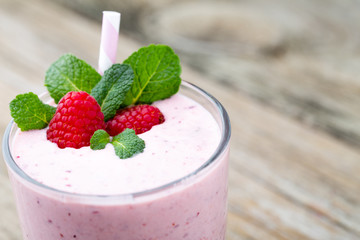 Raspberry milk shake with mint decor.