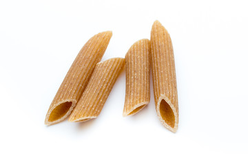 Rye flour macaroni pasta close up isolated on white.