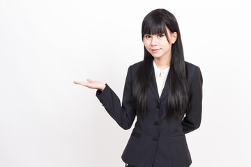 asian business woman in welcome pose with open hand