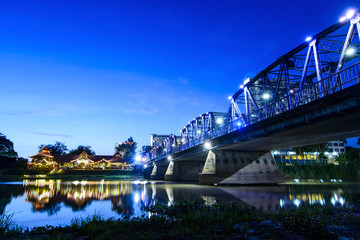 Iron bridge At twilight time Chiangmai in Thailand , With Lens Flare