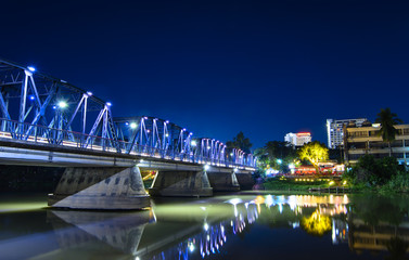 Fototapeta na wymiar Iron bridge At twilight time Chiangmai in Thailand , With Lens Flare