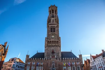 Fototapeten BRUGGE, BELGIUM - JANUARY 17, 2016: Belfort tower in Bruges, touristic center in Flanders city of Brugge and UNESCO world heritage on January 17, 2016 in Brugge - Belgium. © Unique Vision