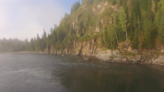 Boat floats on the river. Top view