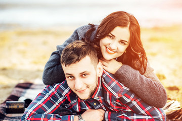 Fototapeta premium Young happy couple outdoor on the beach