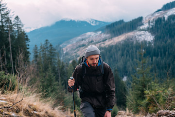 caucasian male hiking in mountains