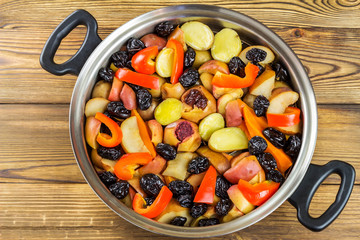 Healthy food, colorful stewed various vegetables in pan, top view
