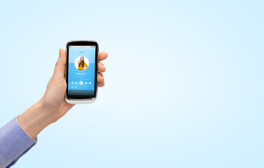 close up of hand with smartphone music player