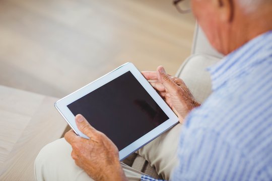 Senior Man Using Digital Tablet