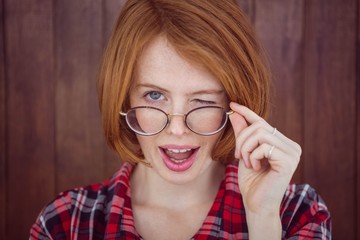 beautiful hipster woman winking at the camera