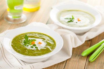 Green pea soup in bowls.