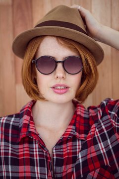 beautiful hipster woman in a hat and sunglasses