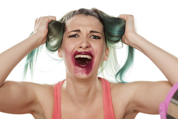 desperate beautiful young woman with smeared lipstick