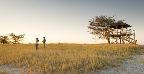 Obraz na płótnie Canvas Young Couple on African Safari