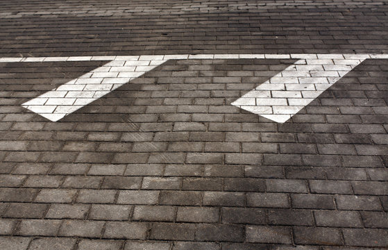 White traffic marks on pavement.