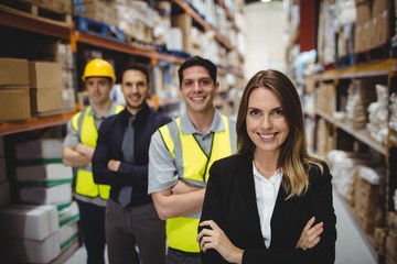 Portrait of warehouse manager and workers