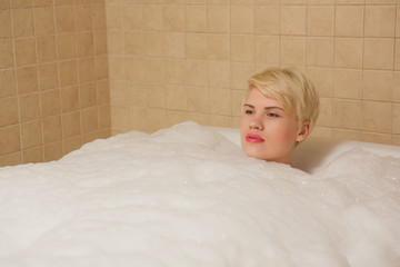 Woman in hydro massage. She receives medical treatments for relaxation.
