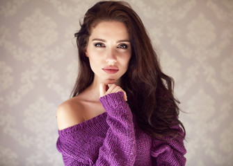 mysterious sensual woman. Natural beauty. A woman in purple swea