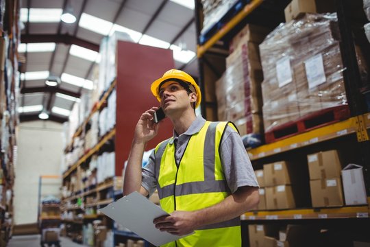 Warehouse worker on a phone call